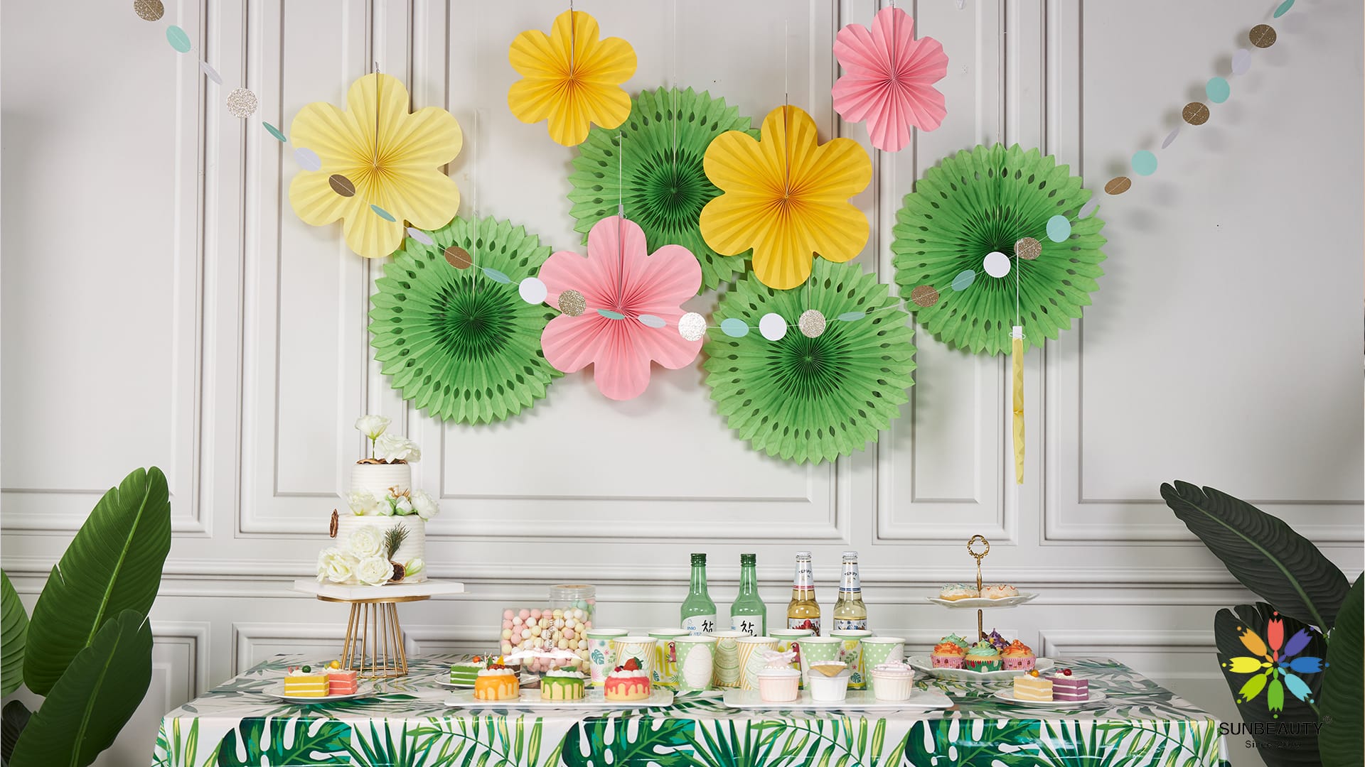 Colorful flower paper fan decorations adding a vibrant and festive touch to a summer party.