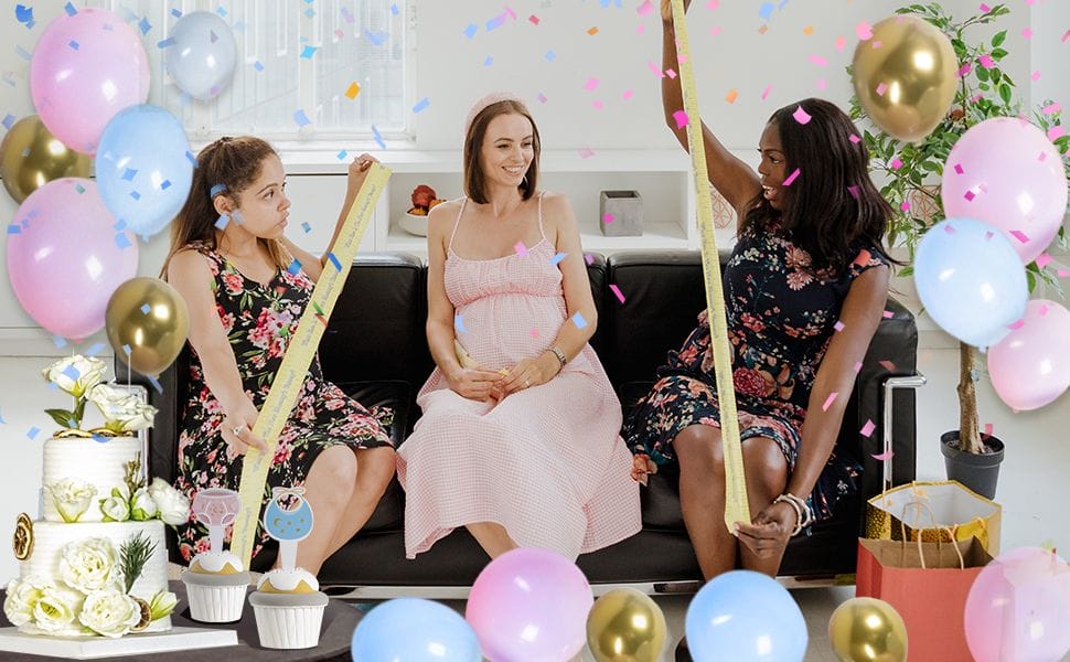 gender reveal party decorations with blue and pink balloons