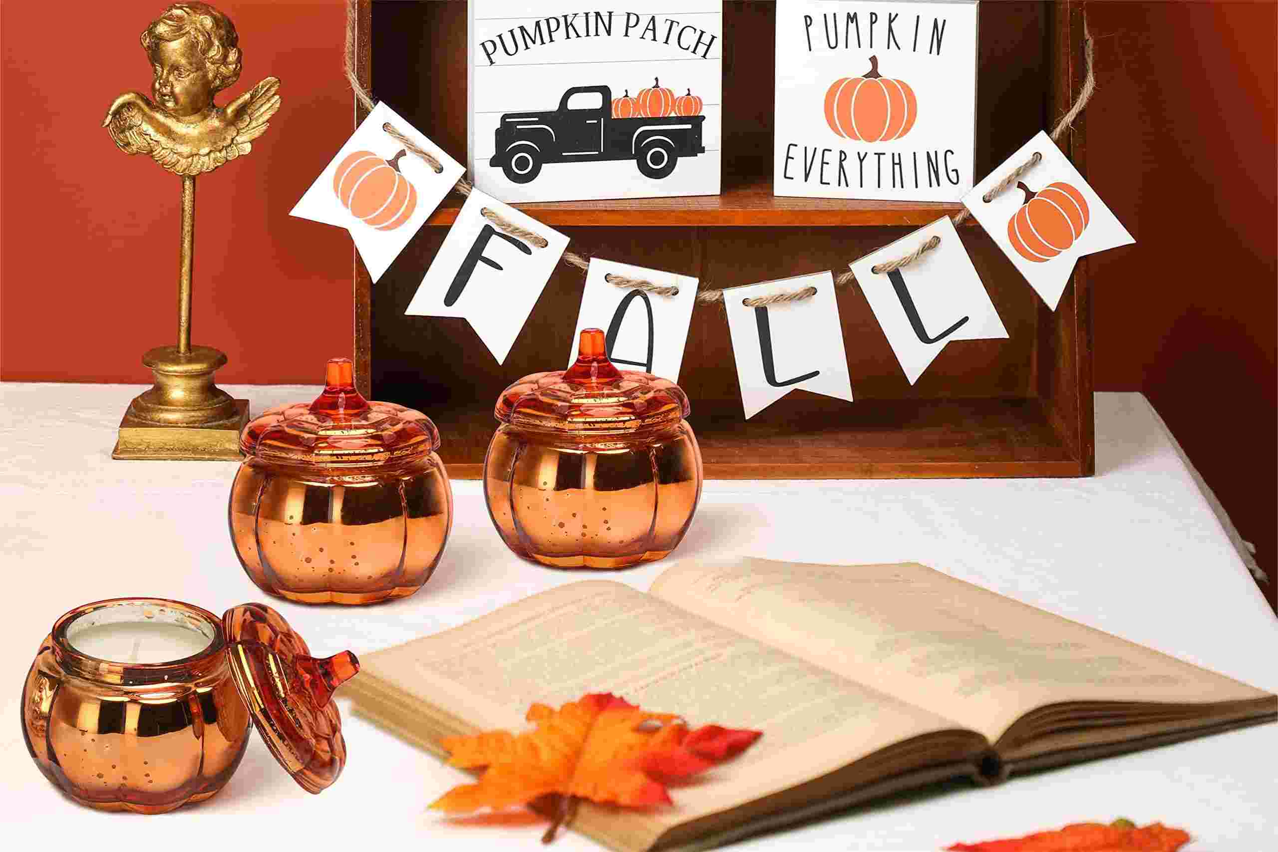 Candlelit Ambiance Warm Glow and Fragrance punpkin candles with fall banner