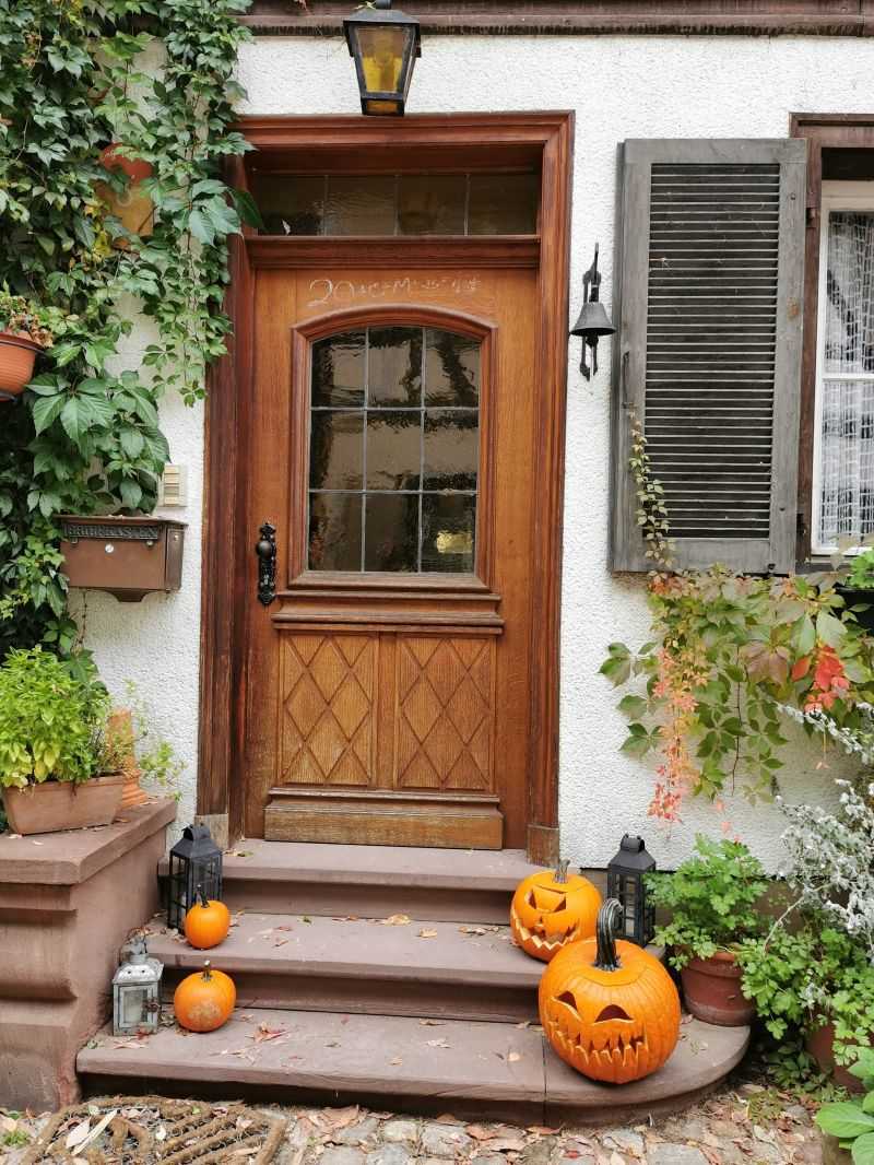 place pumpkins on your porch to greet guests