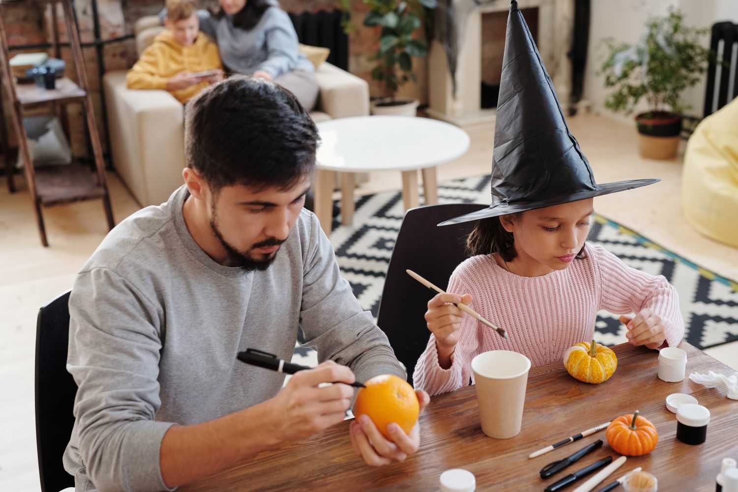 Stay at Home Halloween Games father and daughter are making Halloween DIY crafts