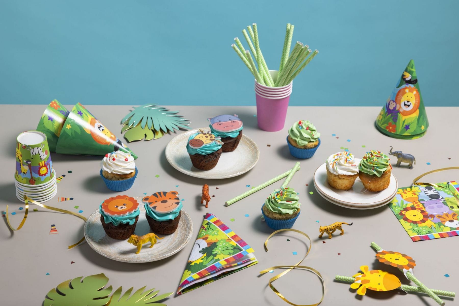 Delicious jungle hunting party cupcake arrangements.