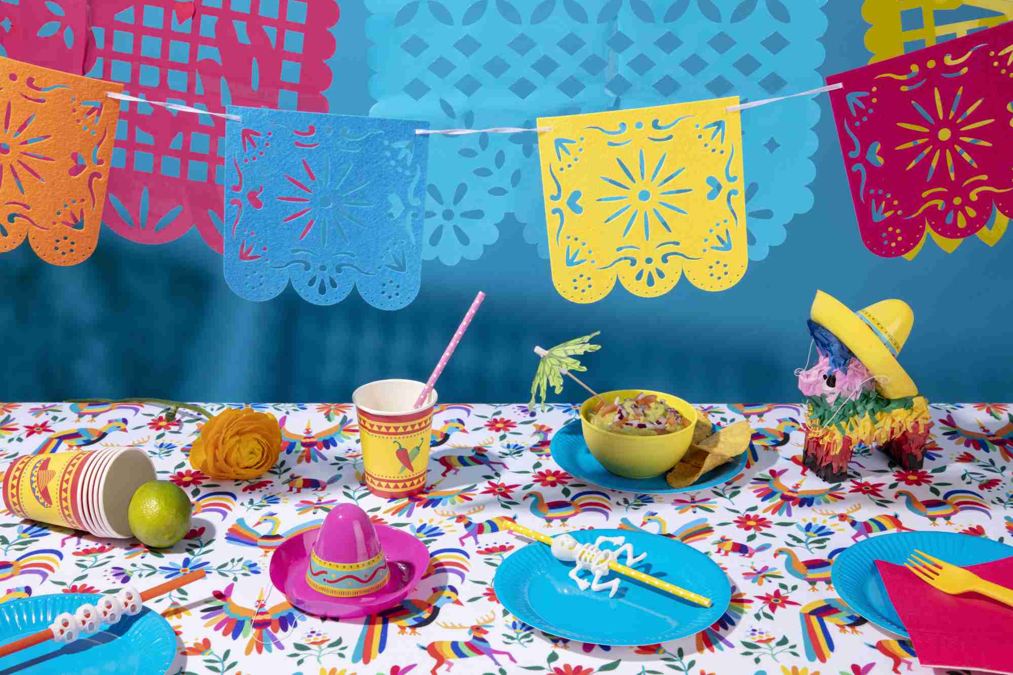 beautiful mexican party decoration with pinata and food
