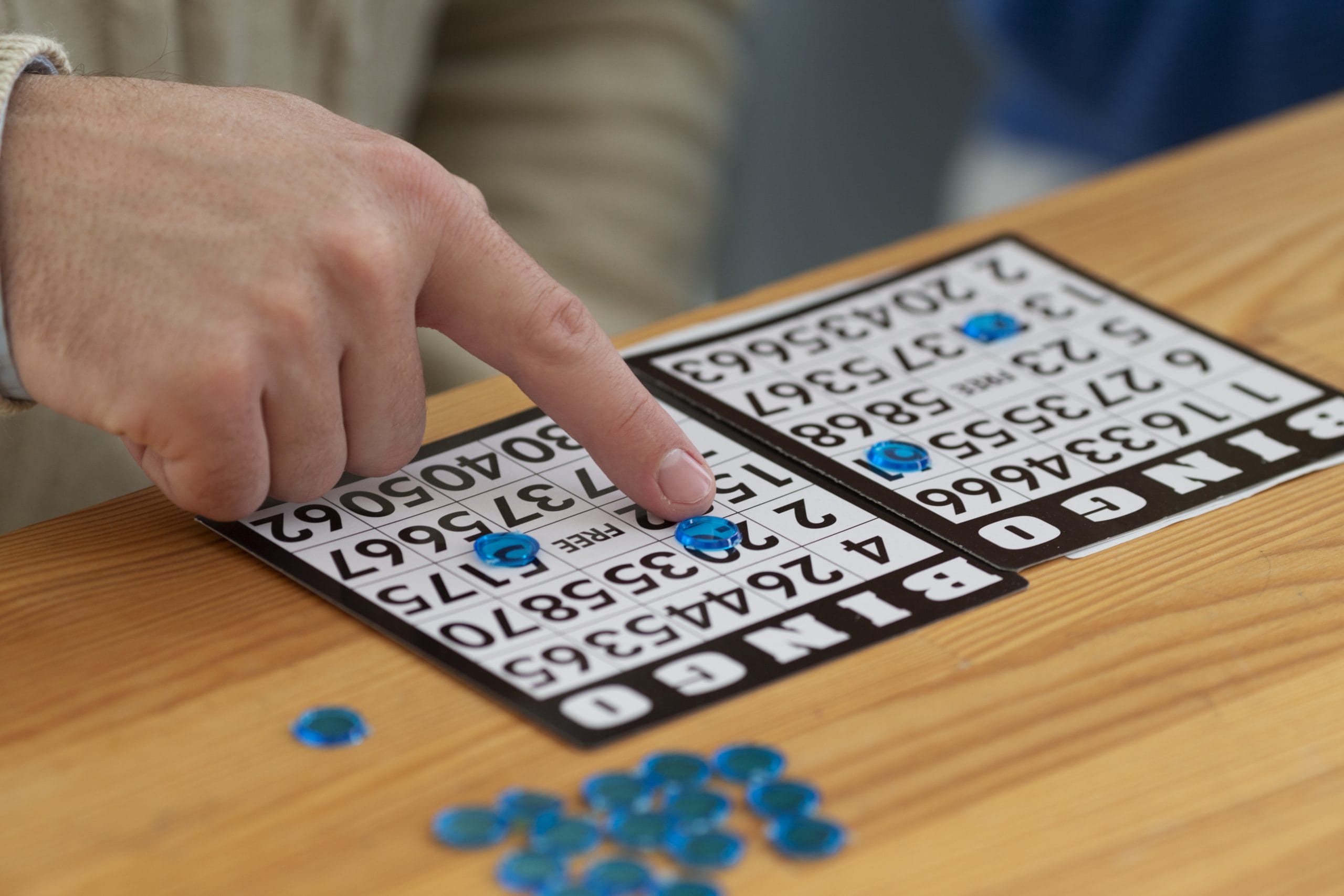 close up hand playing bingo scaled