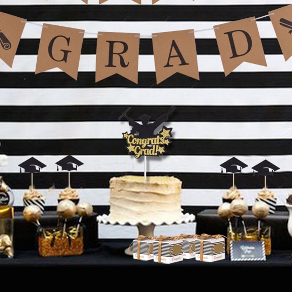 graduation party decorations with banner and cupcake toppers