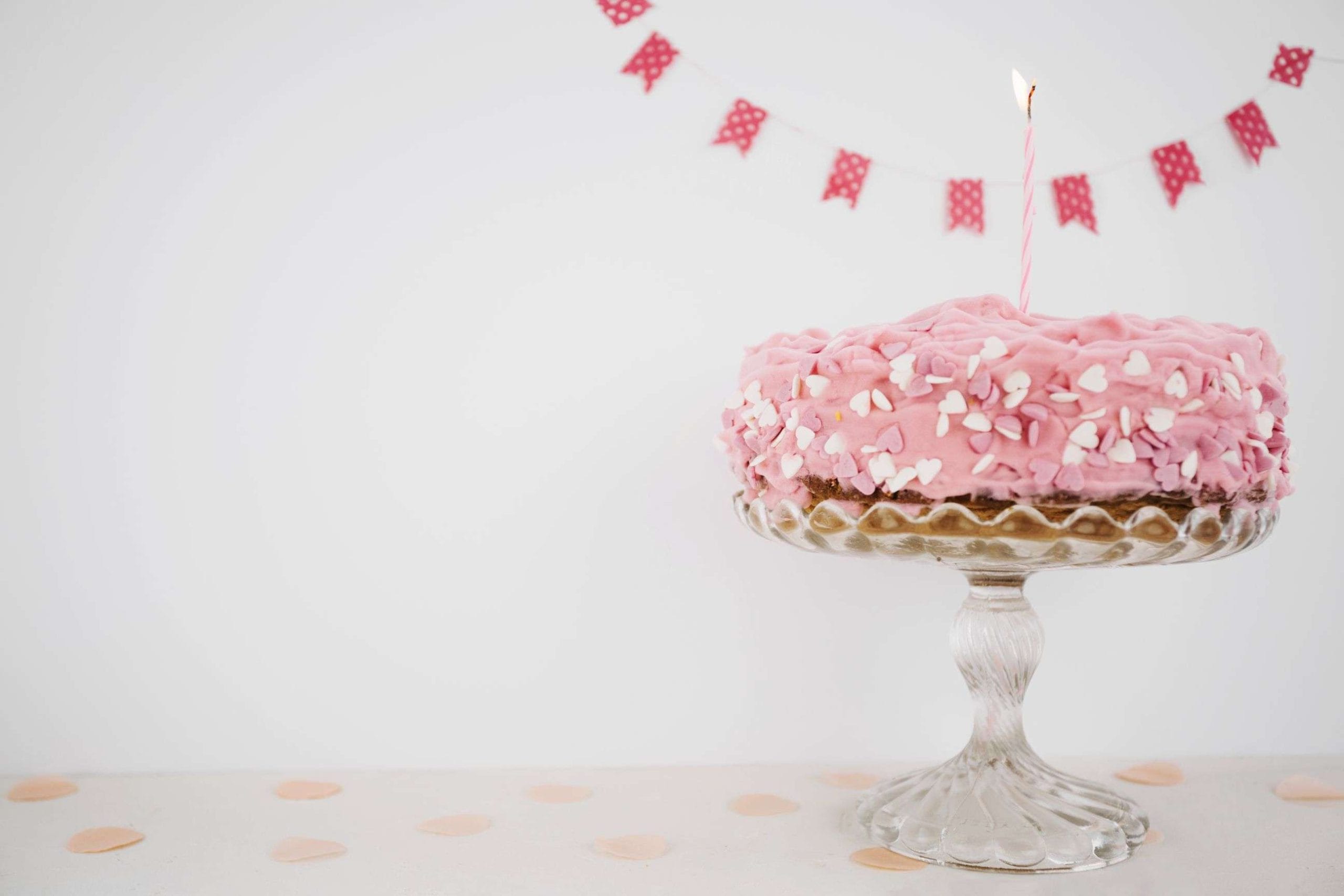 pink cake with candle