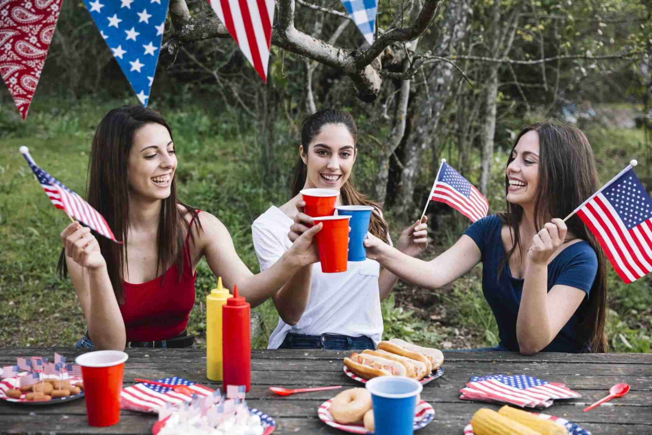 young women glasses independence day celebration with festive bunting and banners