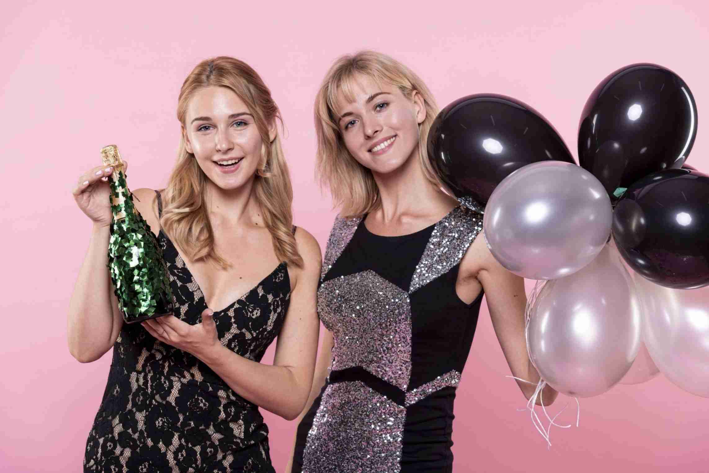 beautiful women holding balloons