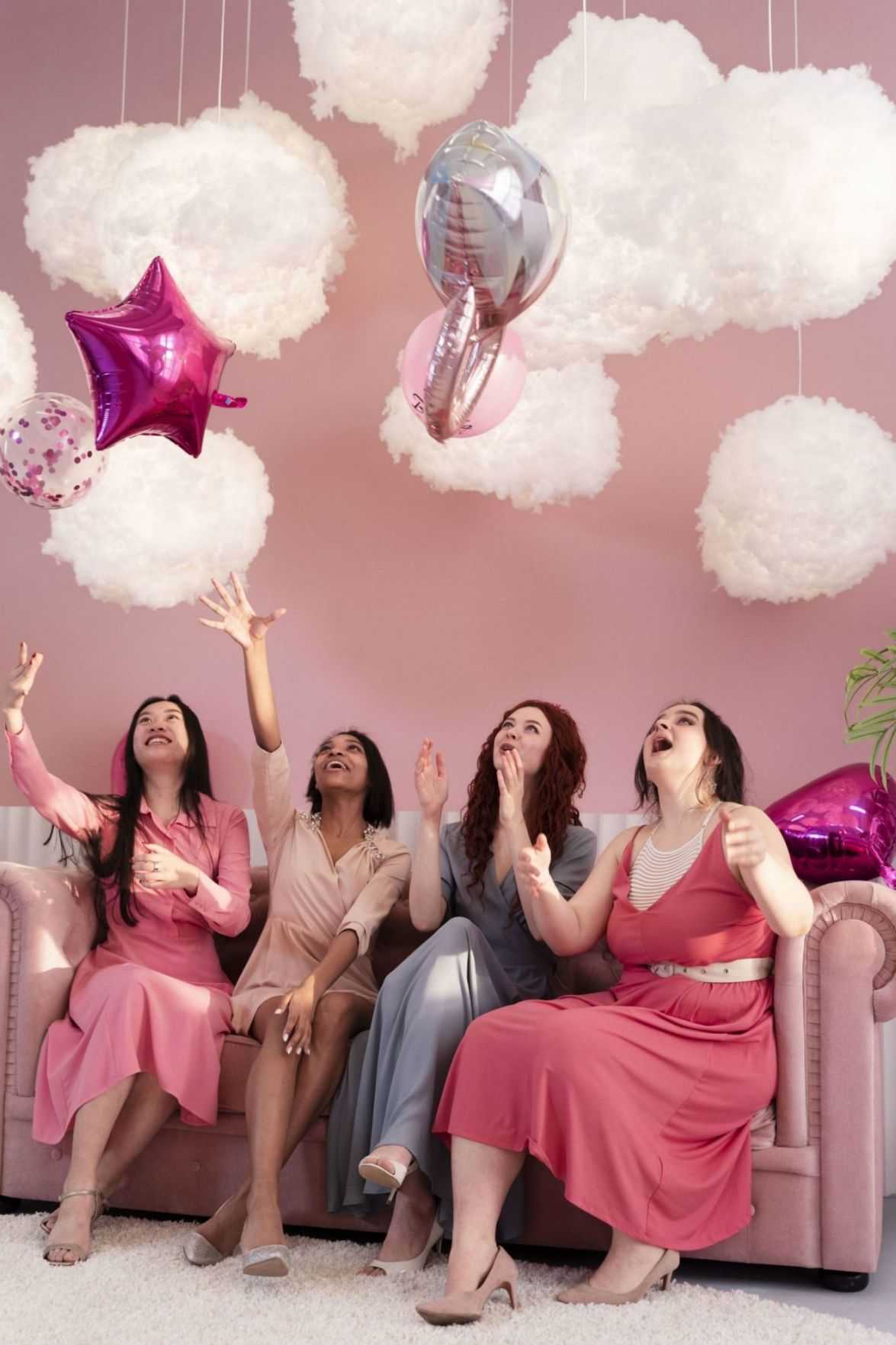 full shot women having fun with balloons