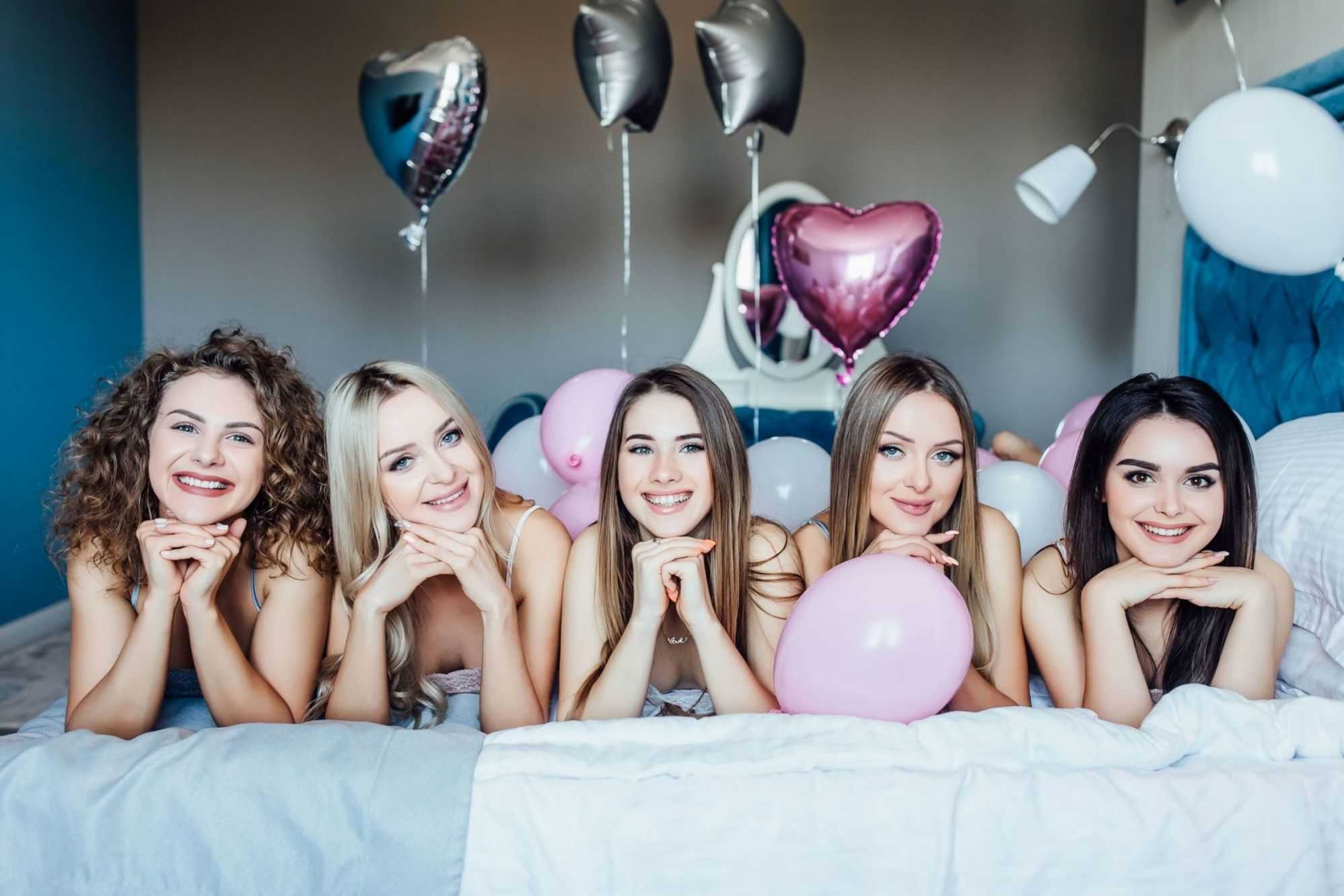 group cheerful beautiful woman lying bed bachelorette party