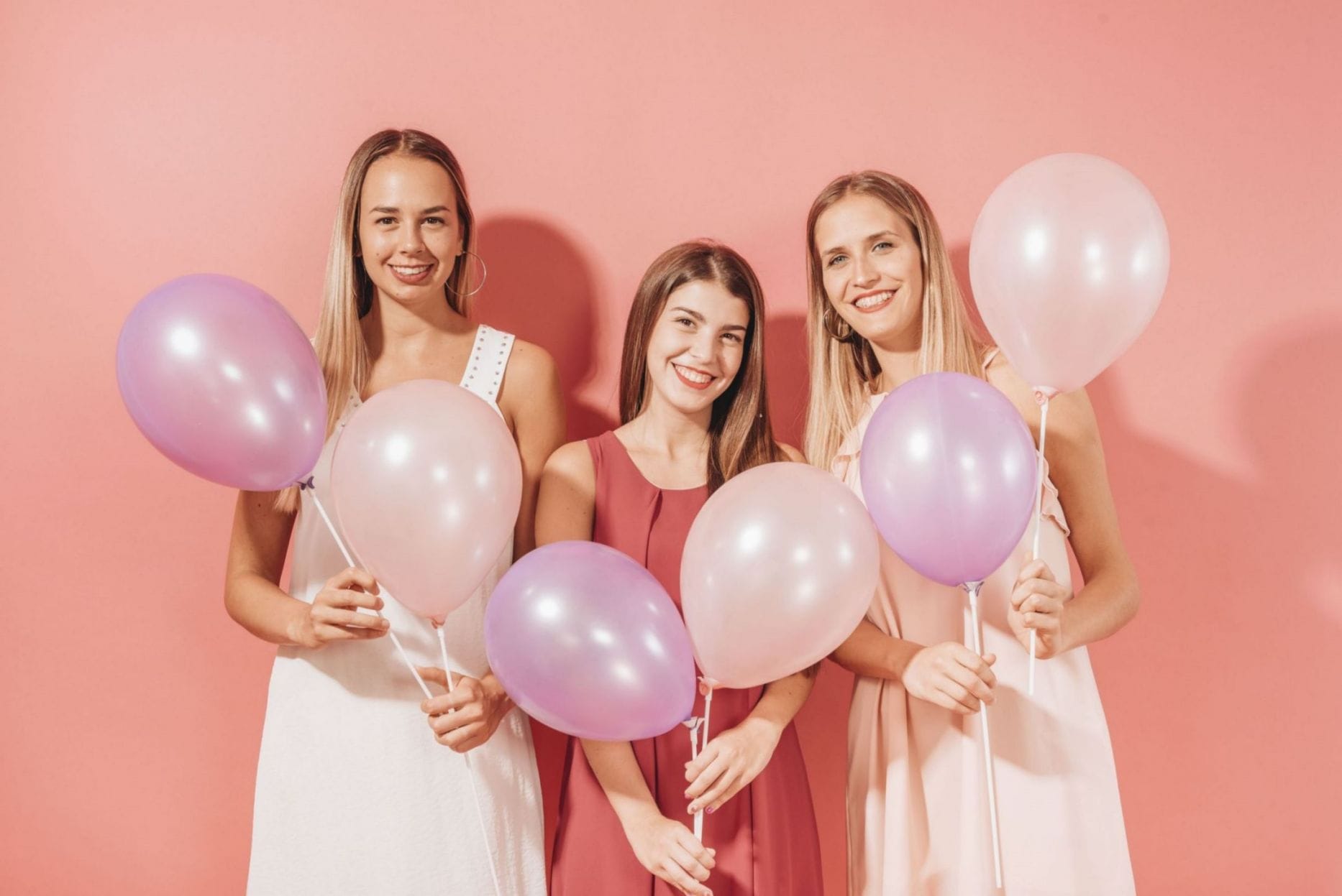 party girls posing with balloons bachelorette party