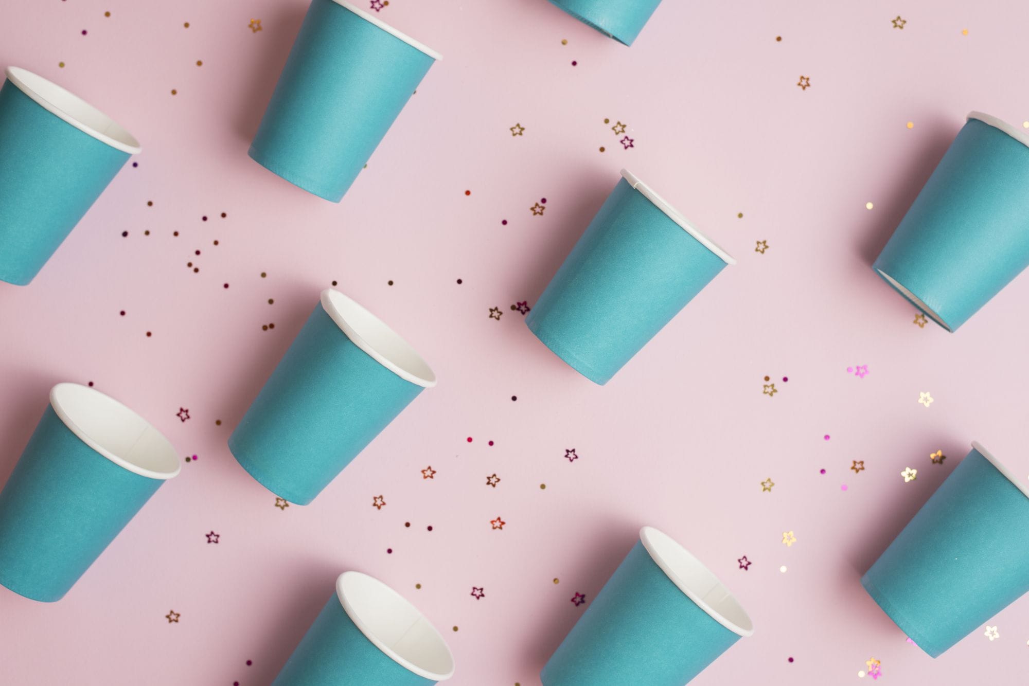 blue disposable paper cup with golden confetti