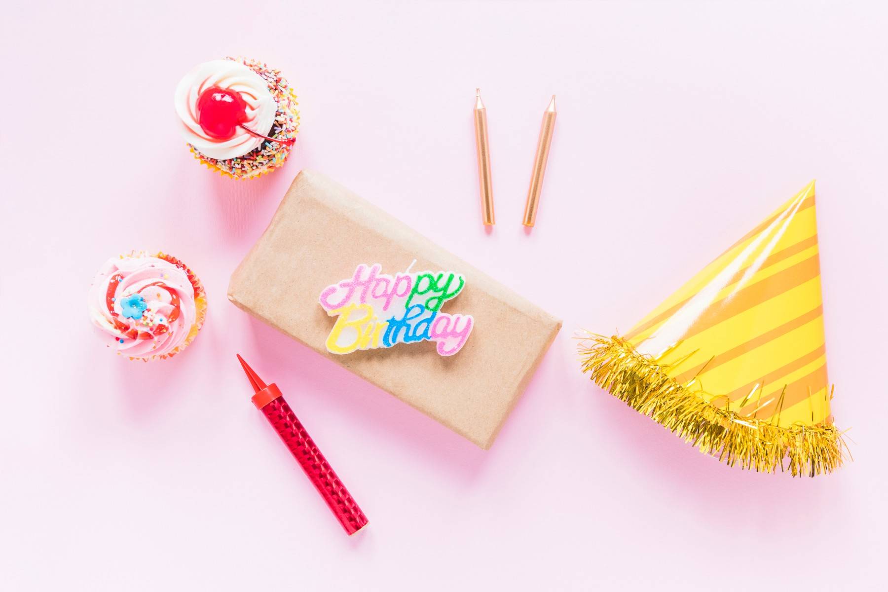 candles hat near cupcakes present