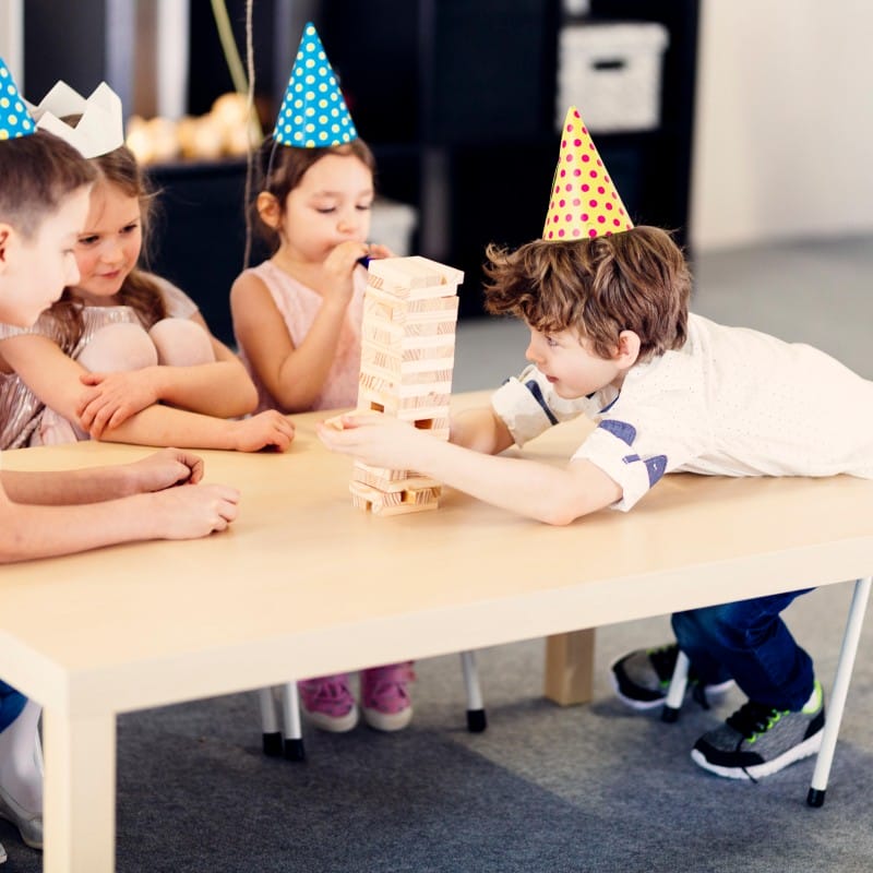 children-colored-caps-playing-game