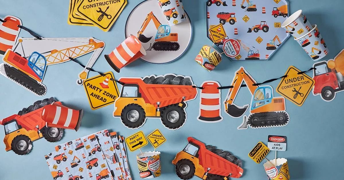 A playful set with plates, cups, napkins, and cutouts of excavators, dump trucks, and construction signs, perfect for a little builder's part